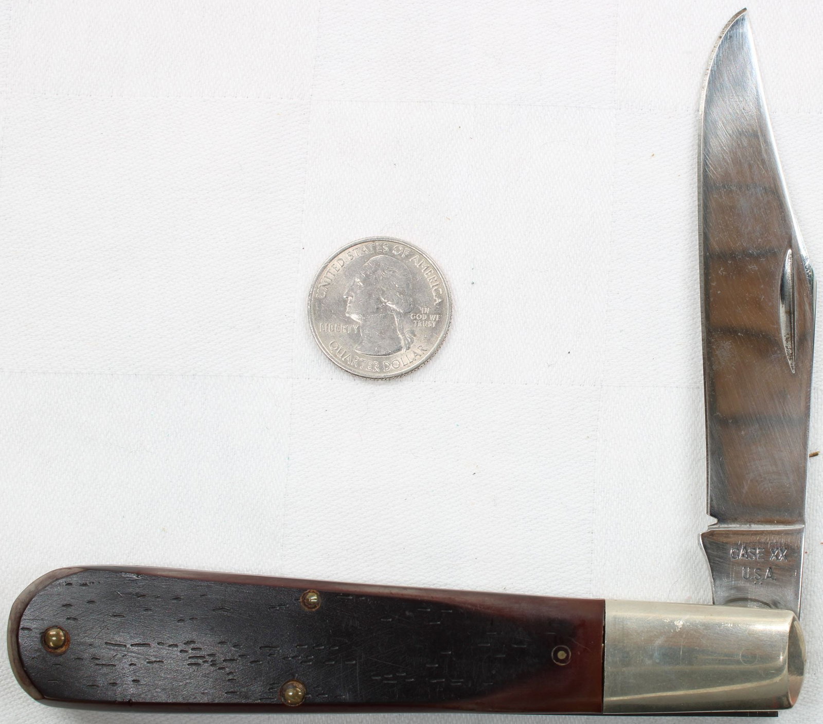 Case Folding Pocket Knife- 1 Blade: Single-blade folding pocket knife with dark brown jigged synthetic handles and nickel silver bolster. Tang stamped Case XX USA. Blade retains good shine with light handling wear; handles show minor su