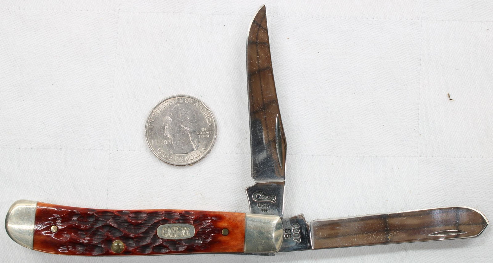 Case XX Folding Pocket Knife - 2 Blade Jack Knife, Red Bone, Pattern 6207 SS: Case XX two-blade folding pocket knife featuring jigged red bone handles, oval Case shield, nickel silver bolsters, and brass liners. Includes clip point master blade and secondary spear/pen blade. Re