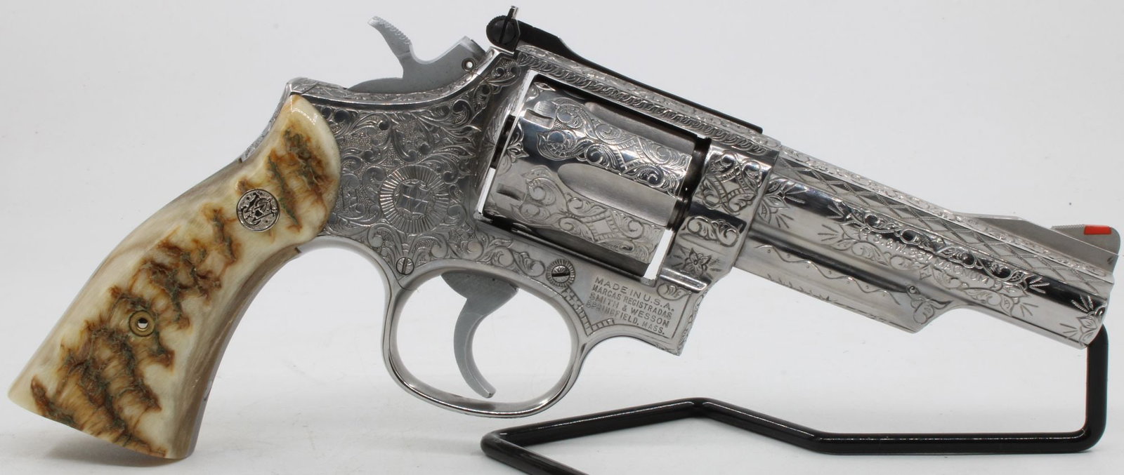Smith & Wesson Model 66-2 .357 Magnum Double Action Revolver — S/N 115K557 Stainless Steel, Fully: Smith & Wesson Model 66-2 double action revolver, .357 Magnum, 4" barrel, stainless steel. Fully engraved overall in dense American scroll with geometric crosshatch border accents, full coverage inclu