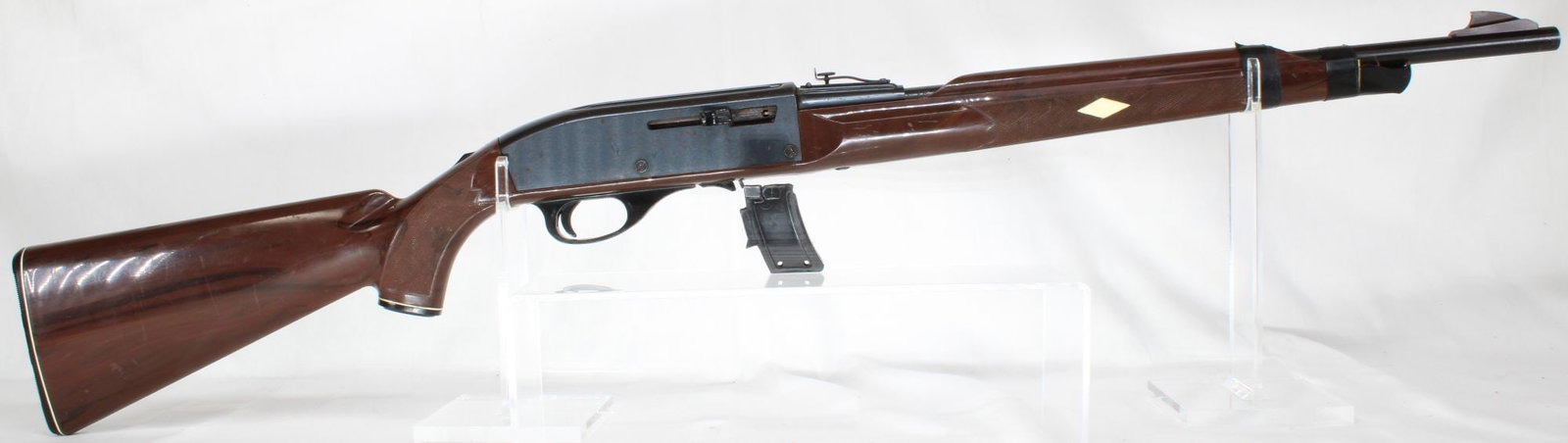 Remington Mohawk 10 C .22 LR Semi-Automatic Rifle with Magazine, S/N 2276133: Remington Mohawk 10 C semi-automatic rifle chambered in .22 LR. Features synthetic vinyl stock and 18-inch barrel. Includes one detachable magazine. Serial number 2276133 indicates mid-production manu