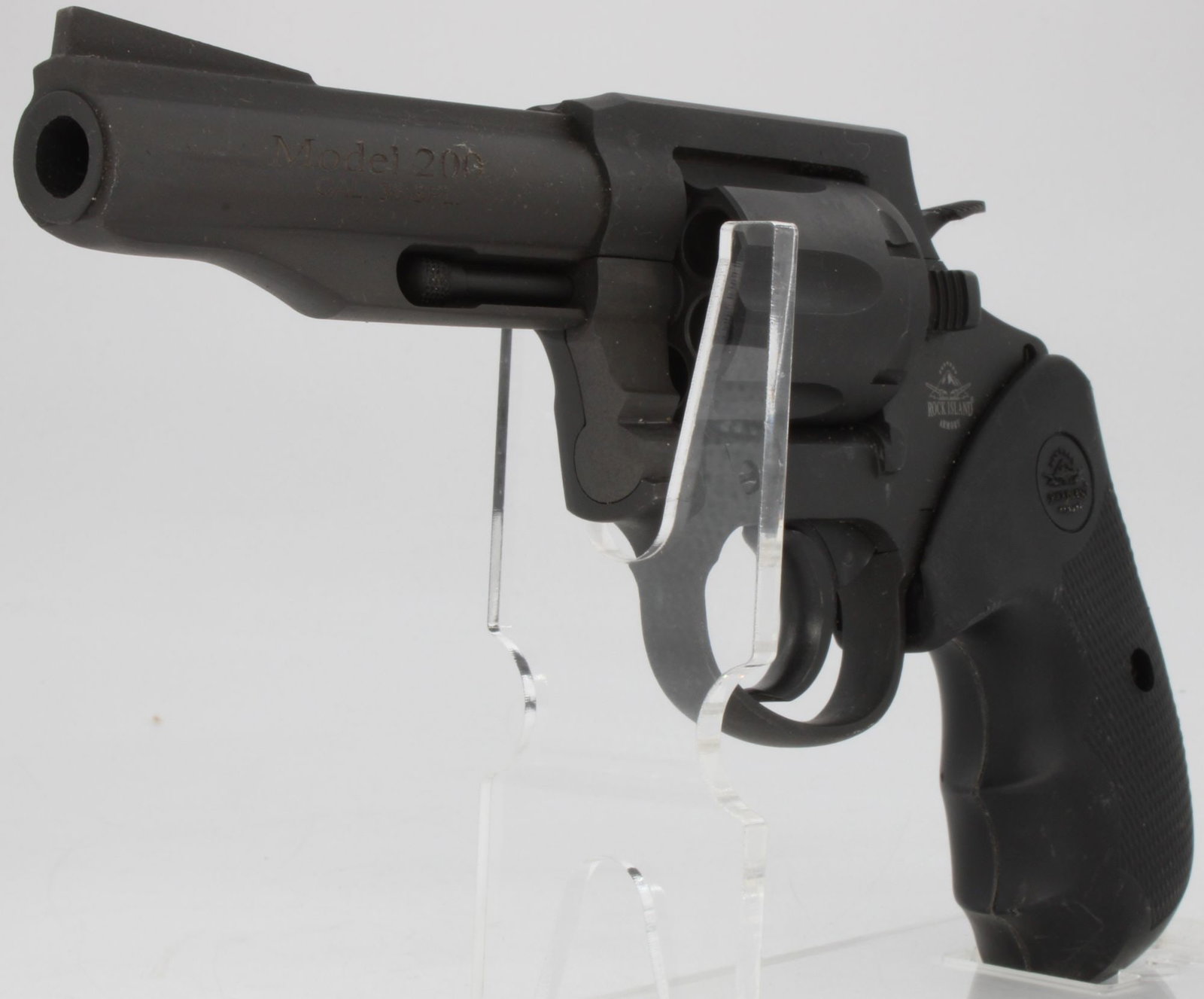 Rock Island Armory Model 200 .38 Special Double Action Revolver w/ Holster: Rock Island Armory Model 200 double-action revolver chambered in .38 Special with 4-inch barrel and 6-shot cylinder. Features parkerized finish, fixed sights, exposed hammer, and factory black grip pa