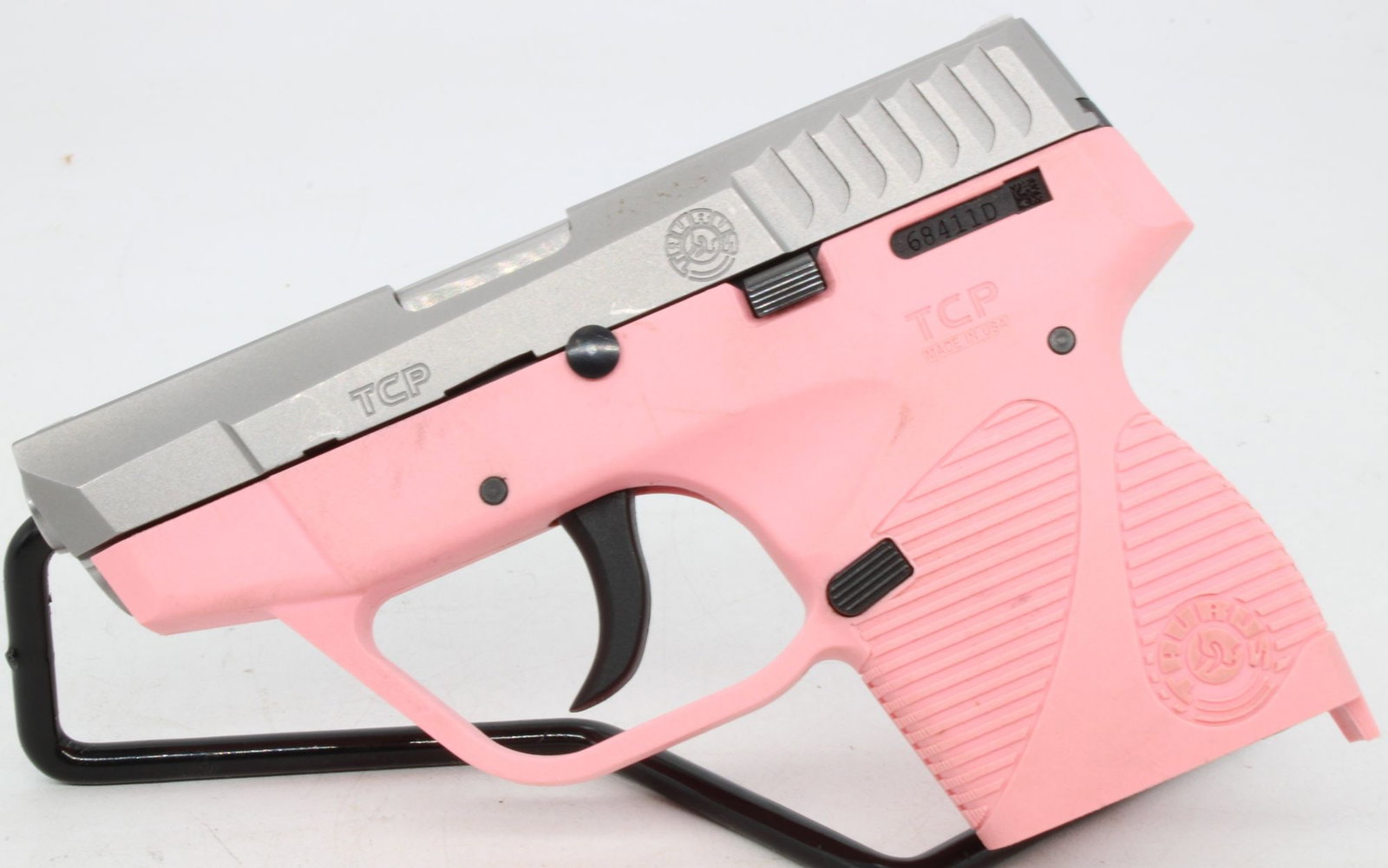 Taurus PT 738 TCP .380 ACP Semi-Automatic Pistol, Pink: Taurus PT 738 TCP semi-automatic pistol chambered in .380 ACP with compact polymer frame and matte black slide. Features double-action-only trigger, low-profile fixed sights, and lightweight pocket-ca