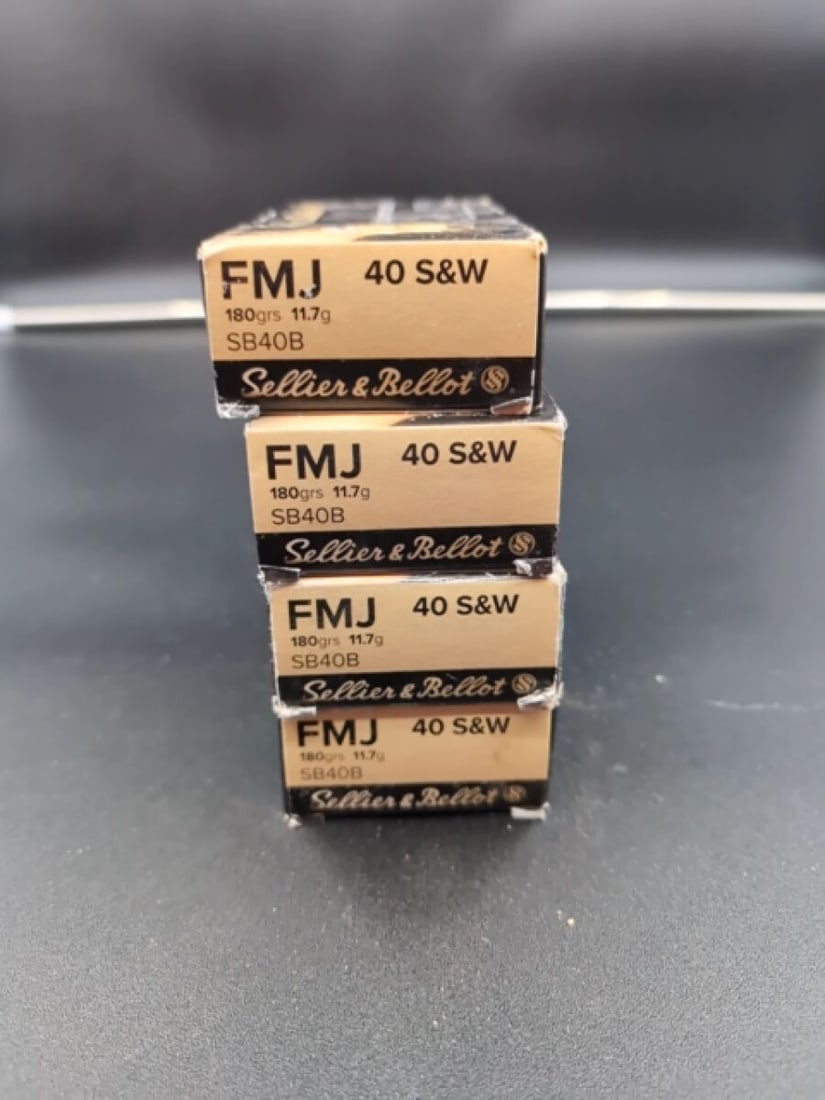 Four Boxes of Sellier & Bellot 40 S&W 180gr FMJ Ammunition: A lot consisting of four individual boxes of Sellier & Bellot 40 S&W caliber ammunition. Each box contains cartridges with 180 grain (11.7g) Full Metal Jacket (FMJ) projectiles, identified by manufact