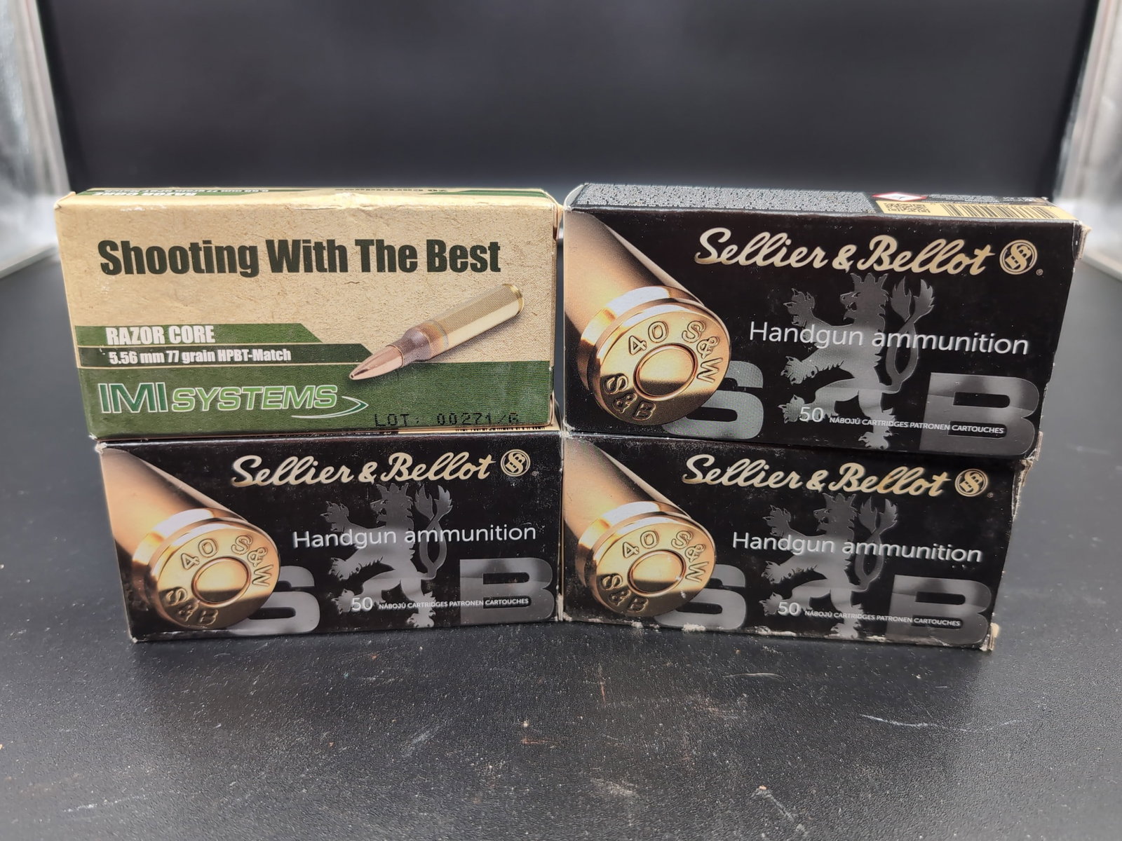 Assorted Ammunition Lot: IMI Systems 5.56mm and Sellier & Bellot .40 S&W: This lot includes one box of IMI Systems Razor Core 5.56mm 77 grain HPBT-Match ammunition containing 20 cartridges, and three boxes of Sellier & Bellot .40 S&W 180 grain FMJ handgun ammunition, each c
