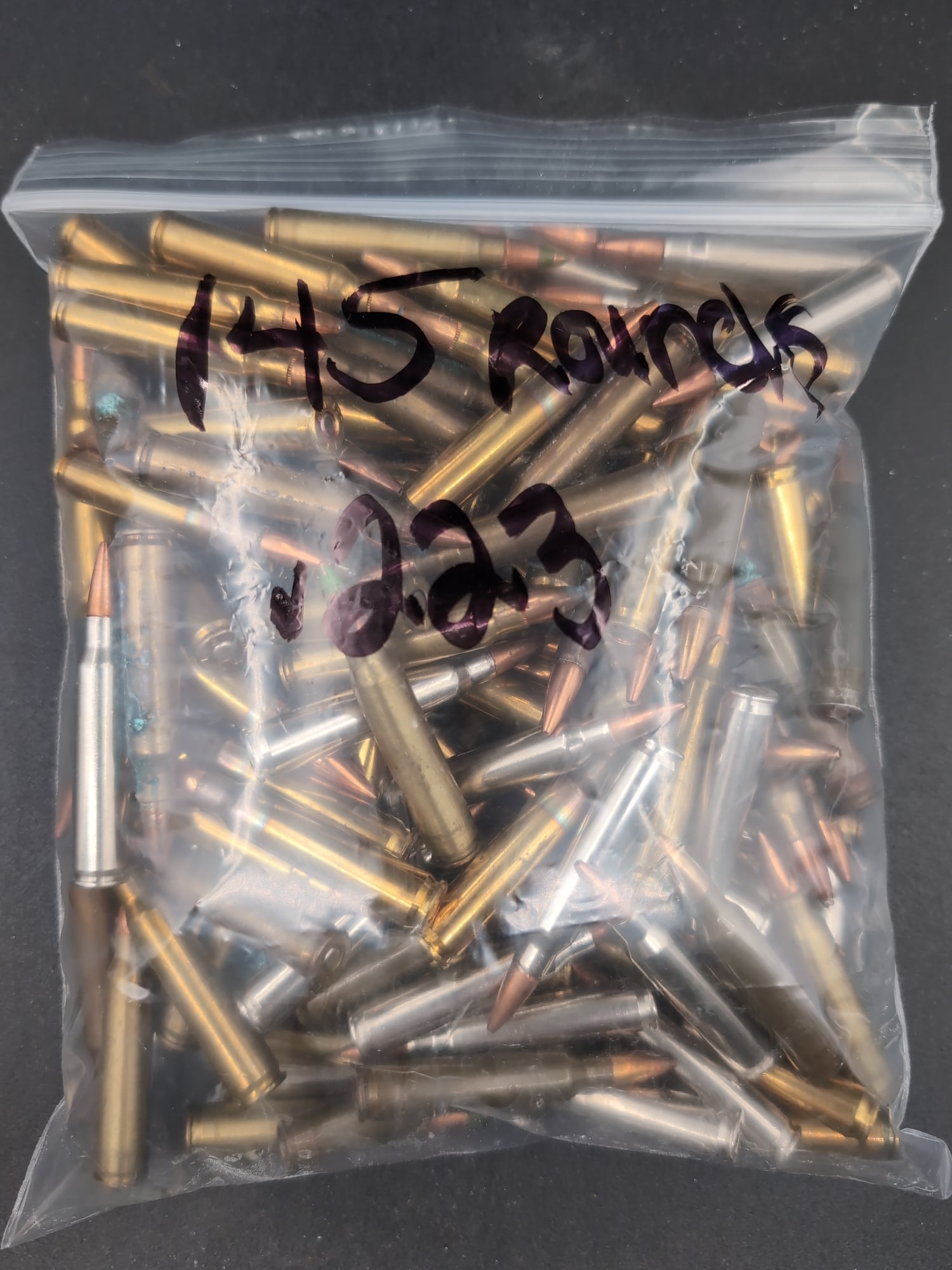 Assorted .223 Caliber Ammunition, 145 Rounds: A plastic bag containing a collection of 145 rounds of .223 caliber ammunition. The lot includes a mix of brass and steel casings with various bullet types.