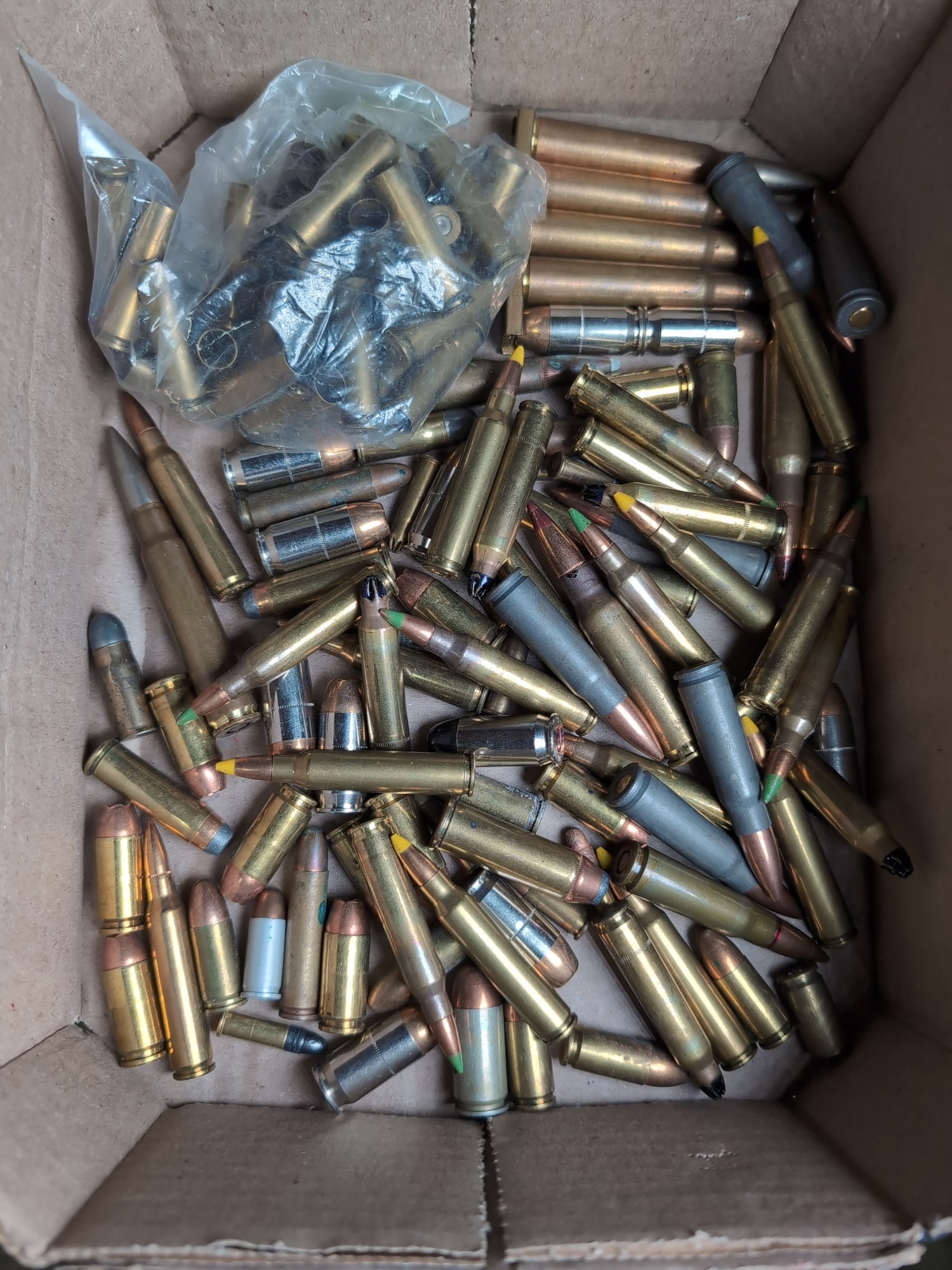 Assorted Mixed Caliber Ammunition Lot: A collection of mixed caliber ammunition, including various rifle and handgun cartridges. The lot features a variety of projectile types, including polymer-tipped, full metal jacket, and hollow point 
