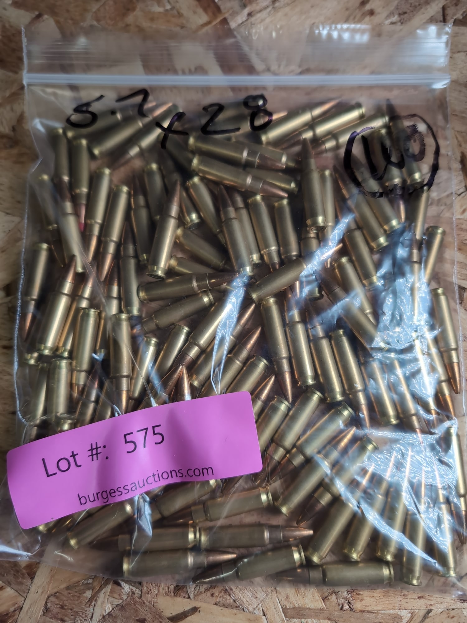 5.7x28mm Ammunition, Bulk Quantity: A bulk quantity of 5.7x28mm caliber ammunition contained within a plastic storage bag. The cartridges feature brass casings and copper-jacketed projectiles.