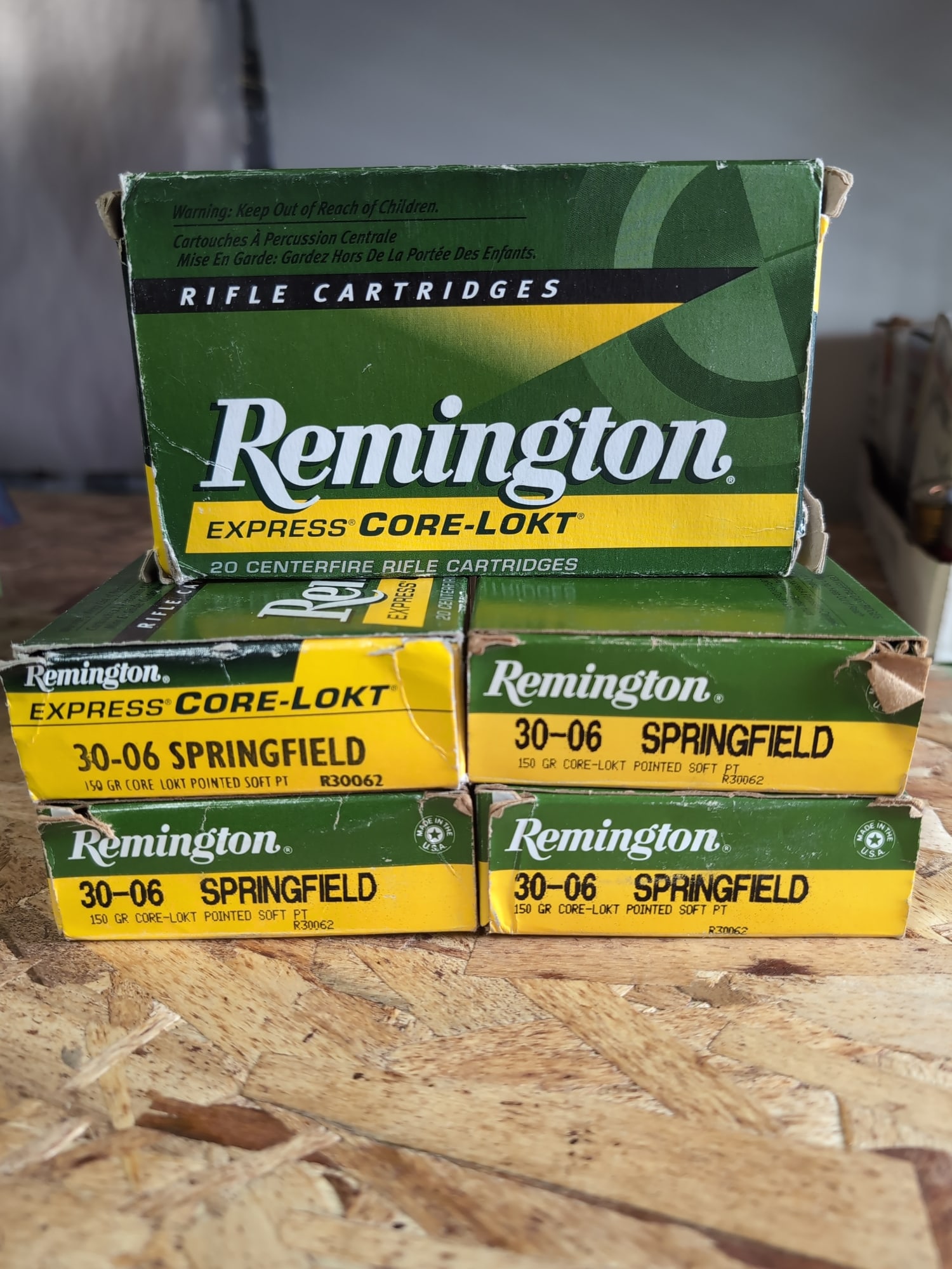 Remington Express Core-Lokt 30-06 Springfield Brass Casings: A collection of Remington Express Core-Lokt 30-06 Springfield rifle cartridge brass casings. The lot includes multiple boxes and a plastic Remington-branded tray containing empty brass casings. Each b