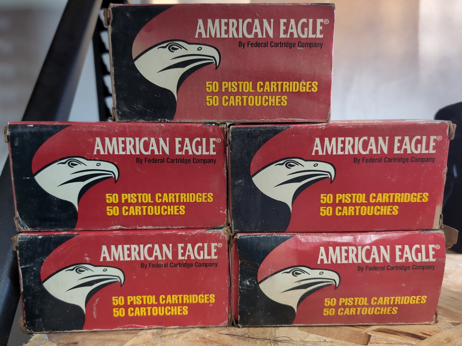 Five Boxes of American Eagle 40 S&W 180 Grain Full Metal Jacket Ammunition: A lot consisting of five boxes of American Eagle by Federal Cartridge Company ammunition. Each box contains 50 pistol cartridges, chambered in 40 S&W with a 180 grain full metal jacket projectile, ide