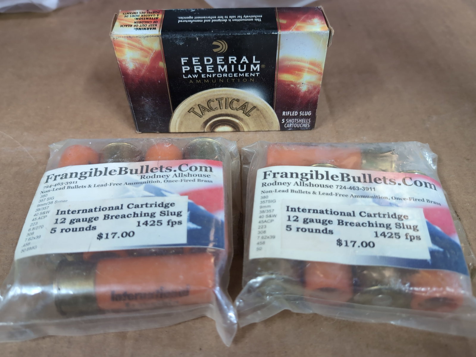 Federal Premium Tactical 12 Gauge Rifled Slugs and International Cartridge 12 Gauge Breaching Slugs: This lot includes one box of Federal Premium Law Enforcement Tactical 12 gauge 2 3/4 inch 1 oz low recoil rifled slug hollow point ammunition (LE127 RS) and two sealed bags of International Cartridge 