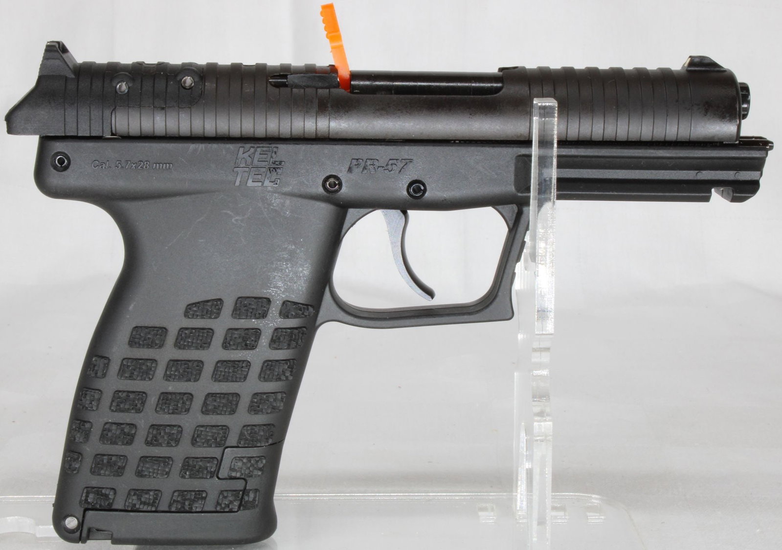 Kel-Tec P57 5.7x28mm Semi-Automatic Pistol w/ Box & Accessories: Kel-Tec P57 semi-automatic pistol chambered in 5.7x28mm with lightweight polymer frame and matte black slide. Features fiber optic sights, accessory rail, textured grip, and slim high-capacity design 