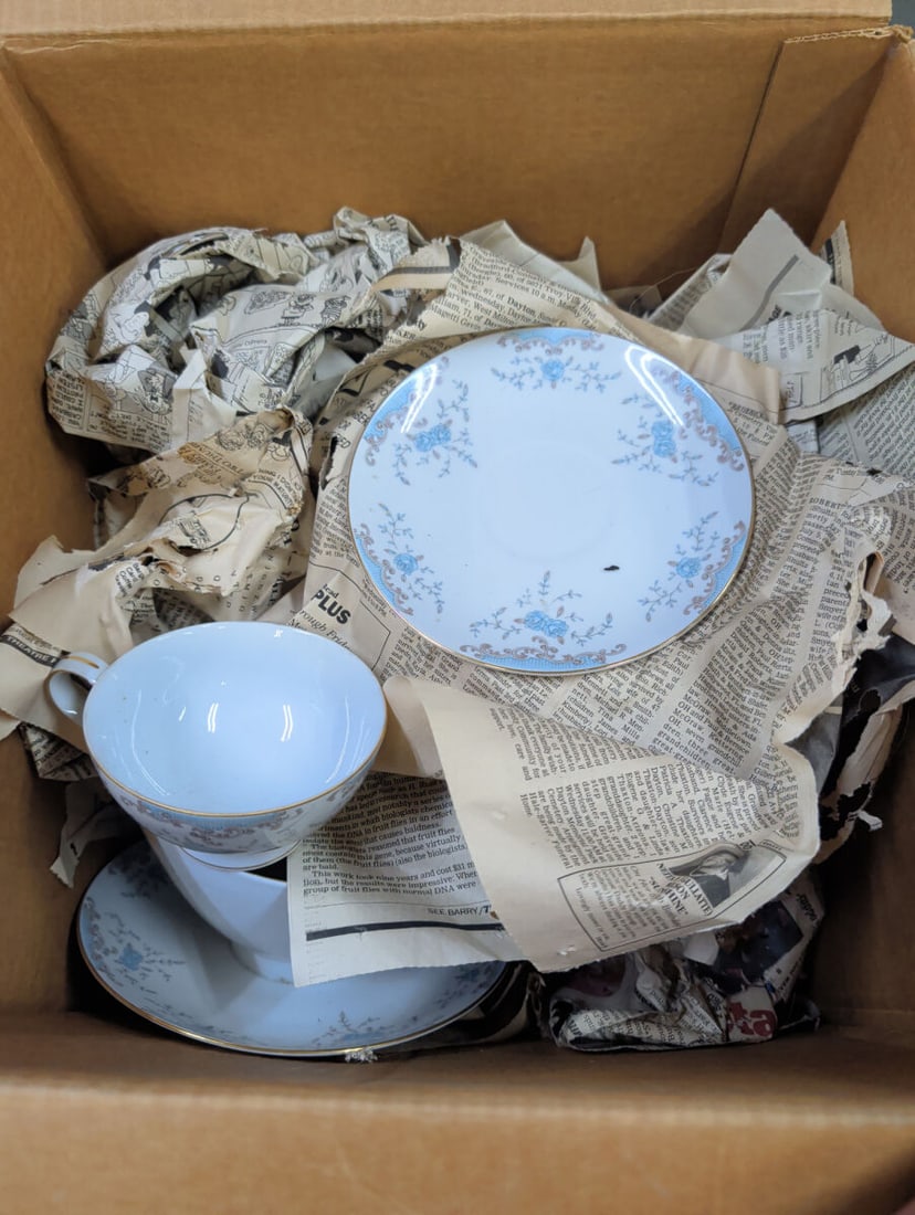 Mikasa Fine China Seville 5303 Dinnerware Set: A collection of Mikasa Fine China in the Seville 5303 pattern, manufactured in Japan. The set features a floral motif with blue accents and gold trim. Included are various plates, bowls, and cups, wit