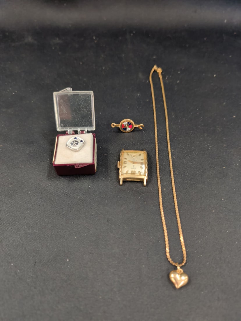 Assorted Jewelry and Timepiece Lot Including Elgin: This lot includes an Elgin 19-jewel watch head with a 10K rolled gold plate bezel and stainless steel back. Also included is a 14K gold platedpin featuring a circular emblem with red, white, and blue 