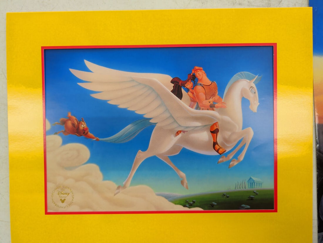 Disney Hercules Exclusive Commemorative Lithograph: Disney Hercules exclusive commemorative lithographs. The collection includes one matted print featuring Hercules, Megara, and Pegasus, and one print depicting various characters including Hades and Ze