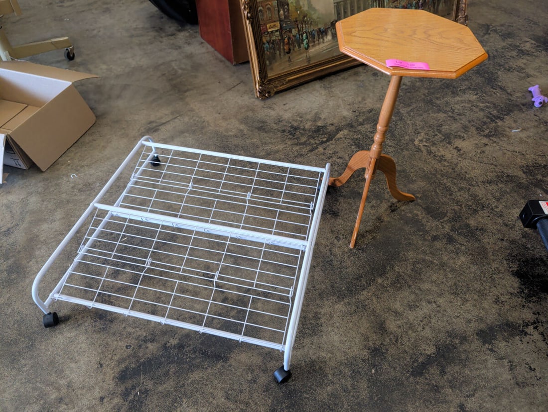 Octagonal Pedestal Side Table and Rolling Wire Sto: This lot includes an octagonal wooden pedestal side table with a tripod base and a white metal wire storage rack equipped with four caster wheels.