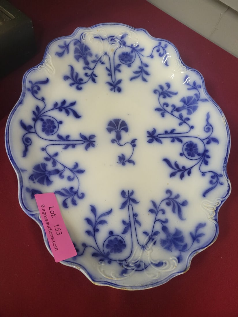 Colonial Semi-Porcelain Hanley England Blue and Wh: An oval serving platter featuring a blue and white floral transferware pattern with a scalloped edge. The underside bears a maker's mark for Colonial Semi-Porcelain, Hanley, England.