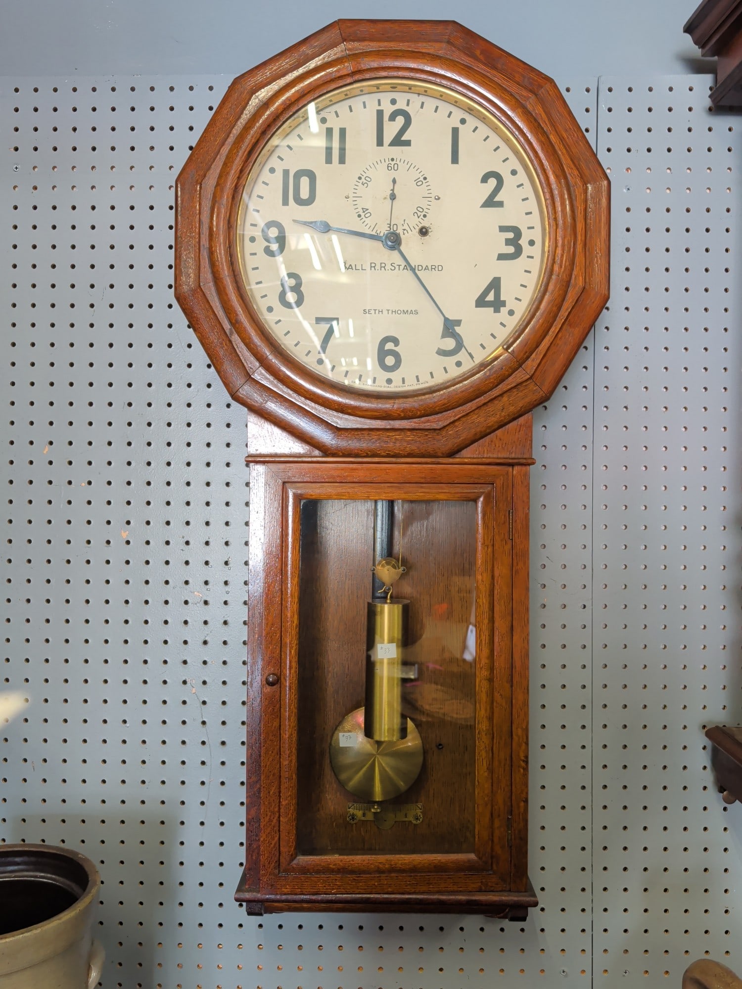 Seth Thomas "Ball Railroad Standard" Oak Regulator: Seth Thomas "Ball Railroad Standard" regulator wall clock housed in an attractive quarter-sawn oak case with octagonal dial surround, glazed lower door, and original painted metal dial marked "Ball R.