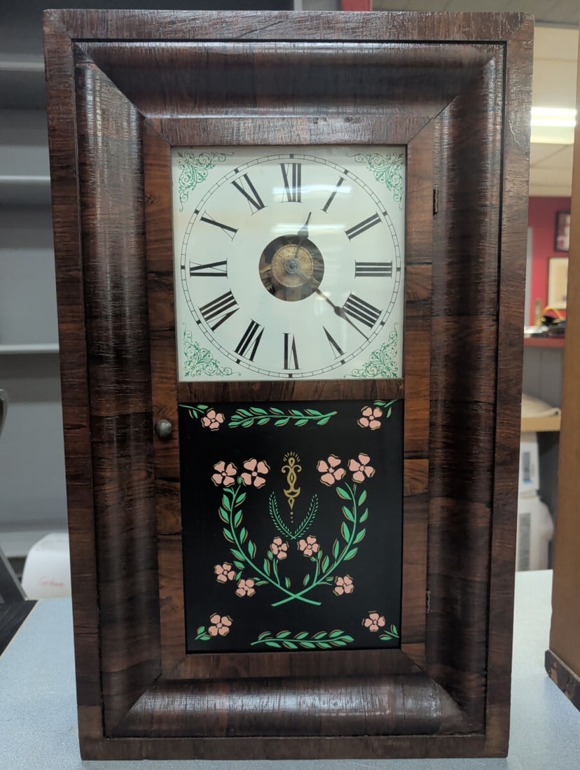 Seth Thomas Weight-Driven Ogee Wall Clock with Ori: Late 19th-century Seth Thomas weight-driven ogee wall clock housed in a figured walnut veneered case with molded frame and single glazed door. The clock features an original painted Roman numeral dial