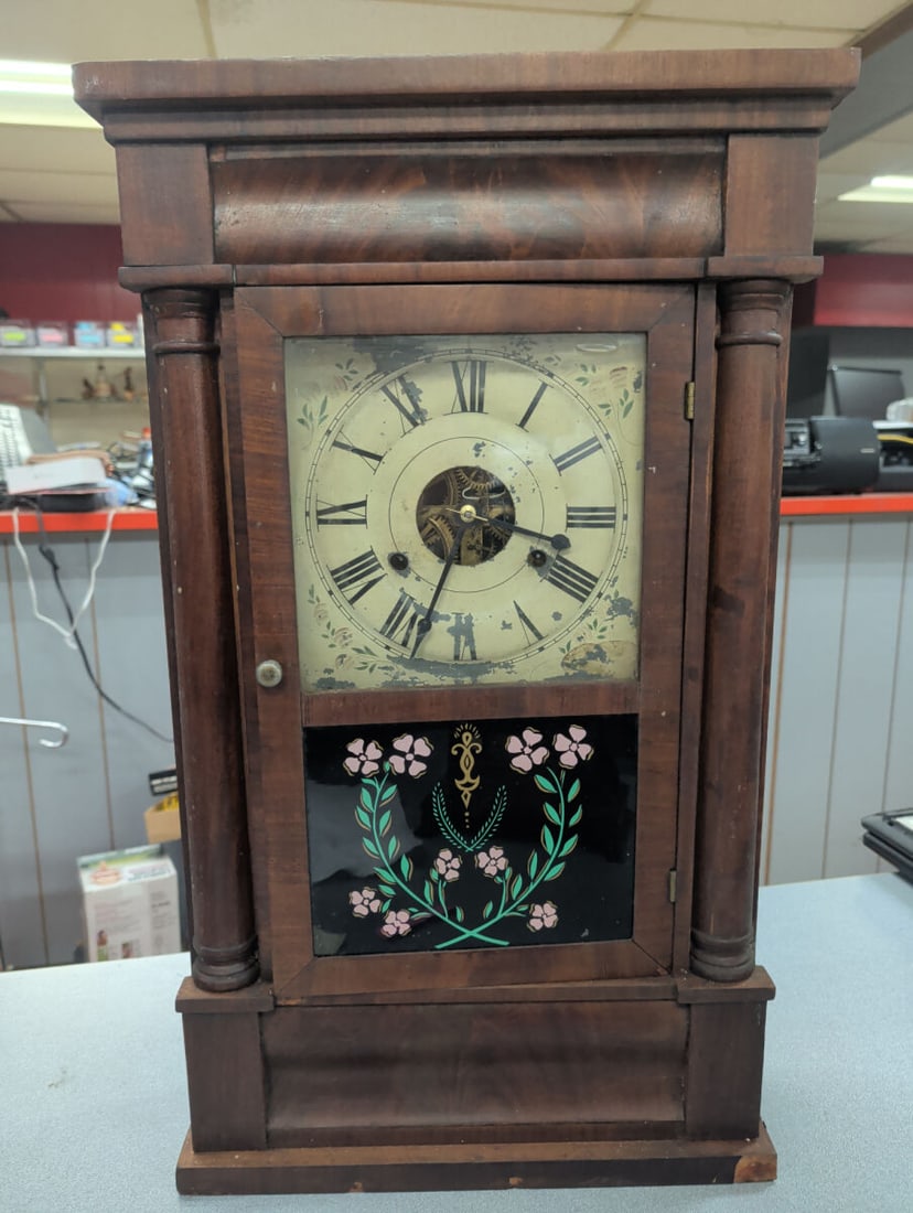 American Weight-Driven Shelf Clock with Painted Ti: Antique American weight-driven shelf clock housed in a walnut-finished case with turned side columns and a molded cornice. The clock features a painted tin Roman numeral dial with an open escapement a