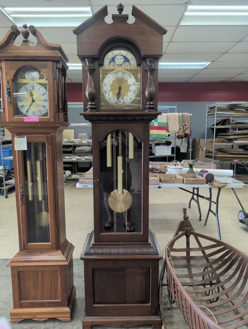 Weight-Driven Triple Chime Grandfather Clock with: A floor-standing wooden grandfather clock featuring a weight-driven movement and a triple chime mechanism. The clock includes a moon phase calendar dial and measures 79 inches in height. A