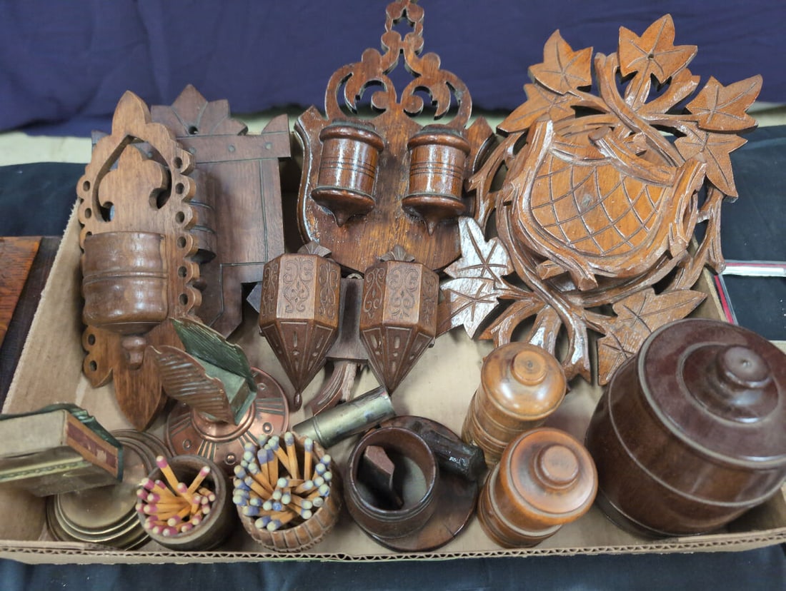 Assorted Wooden and Metal Match Safes and Wall Pockets Collection: Collection of various match safes, match holders, wall pockets, and small wooden containers. Includes carved wooden wall-mounted match holders featuring leaf and scroll motifs, turned wood match holde
