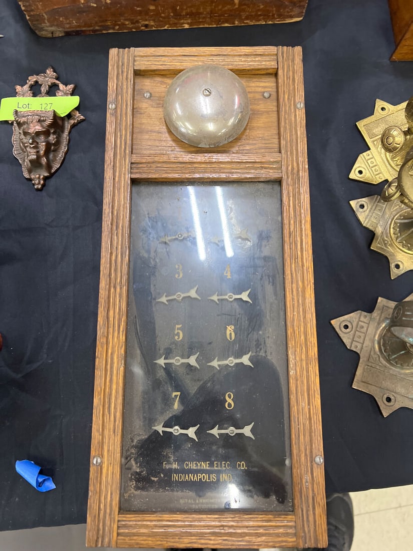 F.H. Cheyne Electric Co. Indianapolis Ind. 8-Indicator Wood Framed Annunciator Panel: F.H. Cheyne Electric Co. Indianapolis Ind. wooden framed electrical annunciator panel featuring an integrated top call bell, glass faceplate with numbered indicators 1 through 8, and arrow indicators.