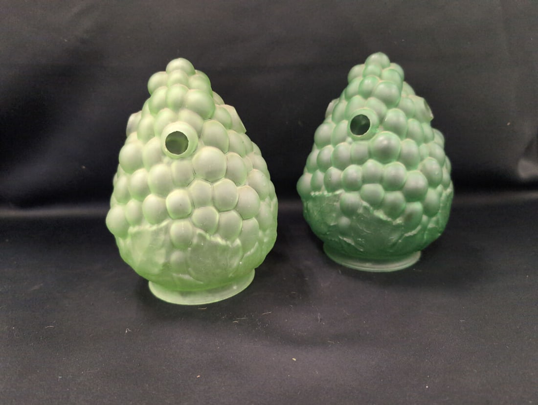 Pair of Frosted Green Glass Grape Cluster Light Shades: Pair of frosted green glass light shades featuring a detailed grape cluster and leaf motif, designed for novelty or accent lighting fixtures. Each shade has a fitter base and an opening near the top.