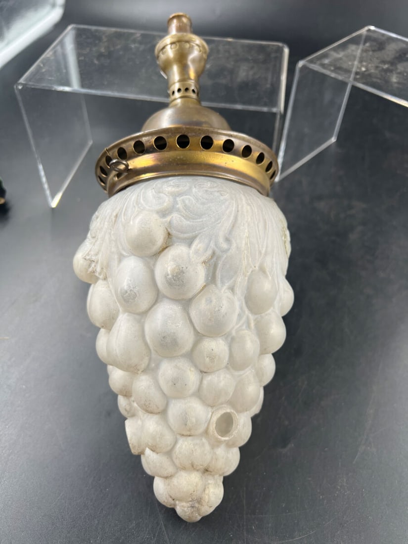 Frosted Glass Grape Cluster Hanging Light Fixture with Patent Dates: Hanging light fixture featuring a frosted glass shade molded in the shape of a cluster of grapes with leaf details. Includes a brass-finish metal fitter and canopy stamped with patent dates including 