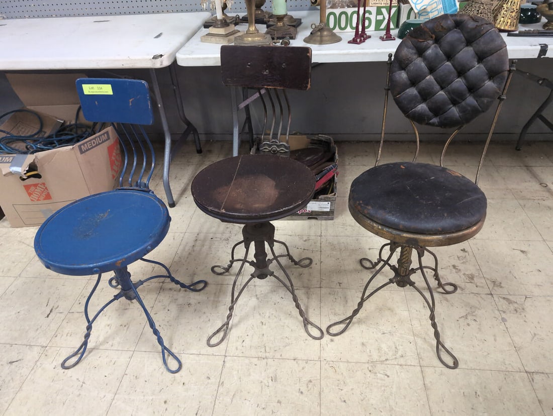 Assorted Collection of Three Adjustable Metal and Wood Swivel Stools: Collection of three distinct adjustable swivel stools featuring metal frames with twisted legs and screw-height adjustment mechanisms. Included in the lot are one solid blue painted metal stool, one s