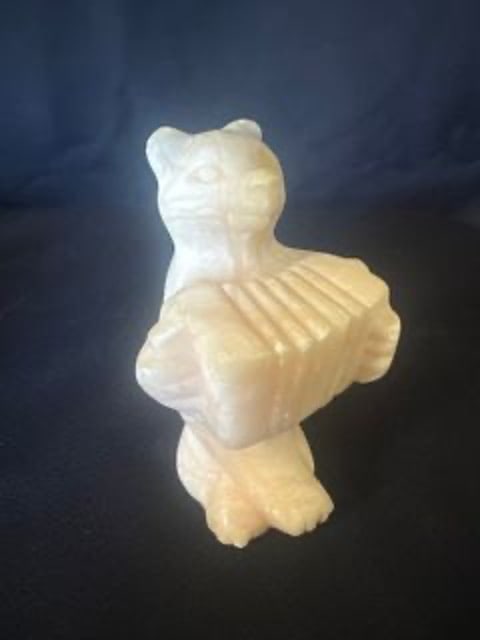 Rare Carved Soapstone Bear: Hard to find. Hand Carved Bear carved of Soapstone playing the accordion. This piece is heavy and of great quality hand carved in great shape. Dimensions: H 4.5 x W 2