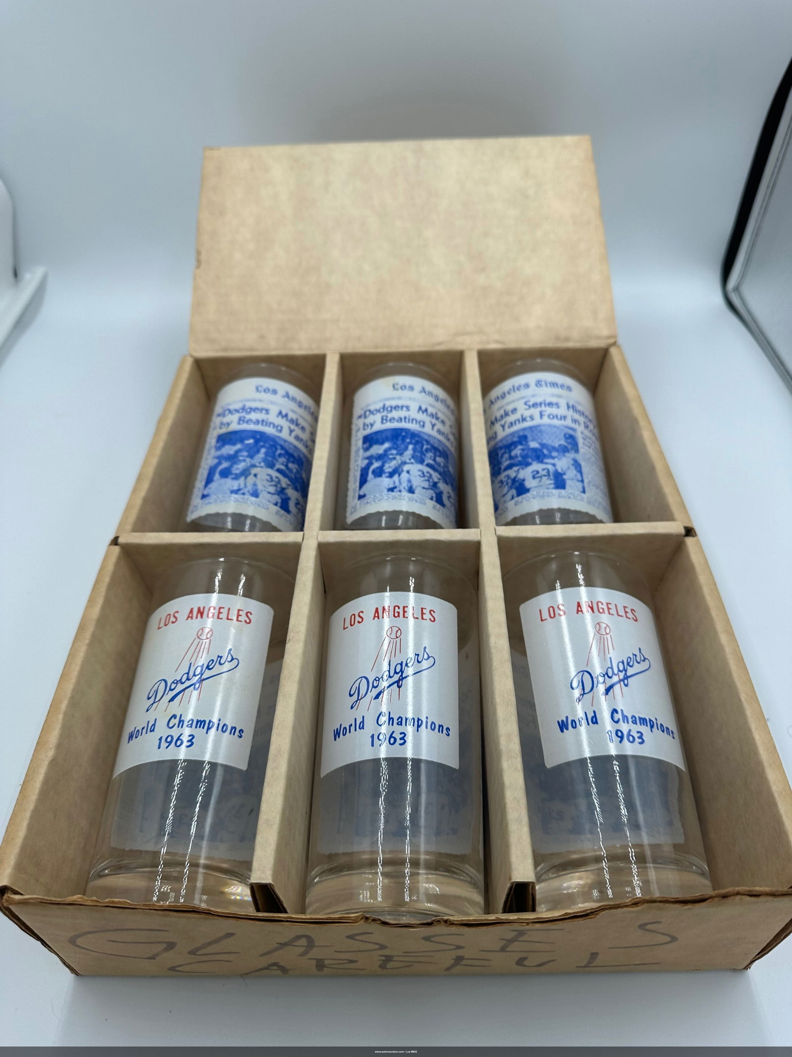 6 vintage 1963 Los Angeles Dodgers World Champion glass cups: This item is a set of vintage 1963 Los Angeles Dodgers World Champion glass cups, likely manufactured as a promotional collectible. Subject: Commemorates the Los Angeles Dodgers beating the New York Y