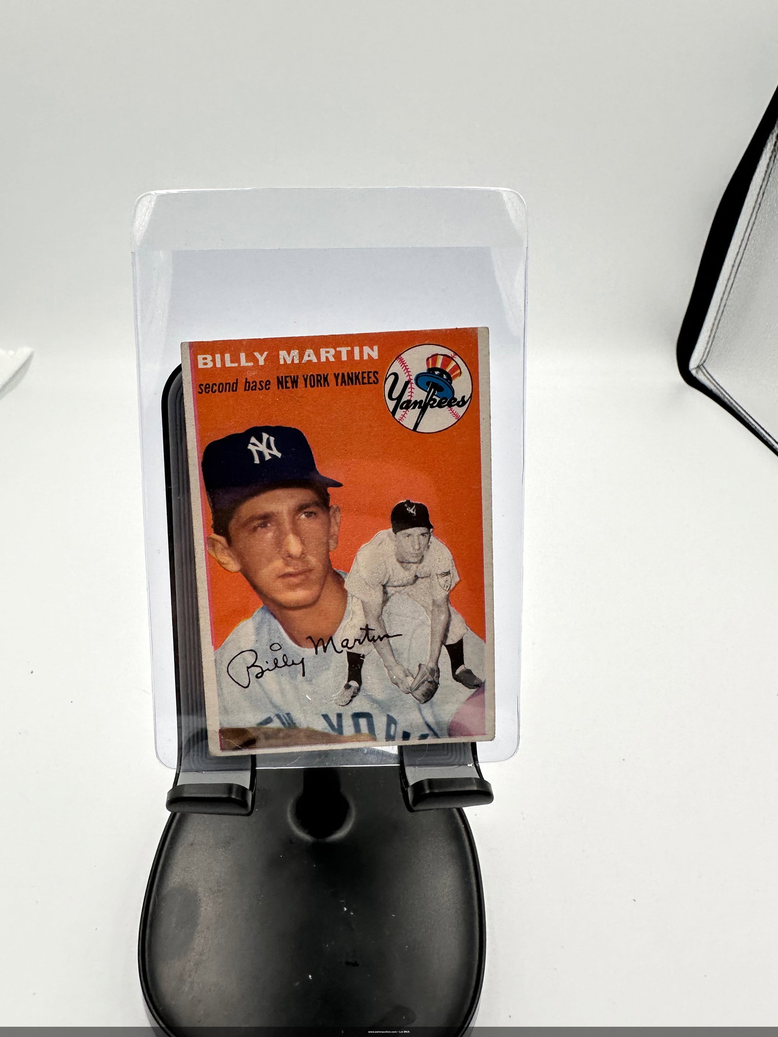 1954 Topps #13 Billy Martin baseball card featuring the New York Yankees second baseman. : This is a 1954 baseball card featuring Billy Martin, a second baseman for the New York Yankees. The card showcases Martin in his Yankees uniform, coupled with a distinctive orange background and his a