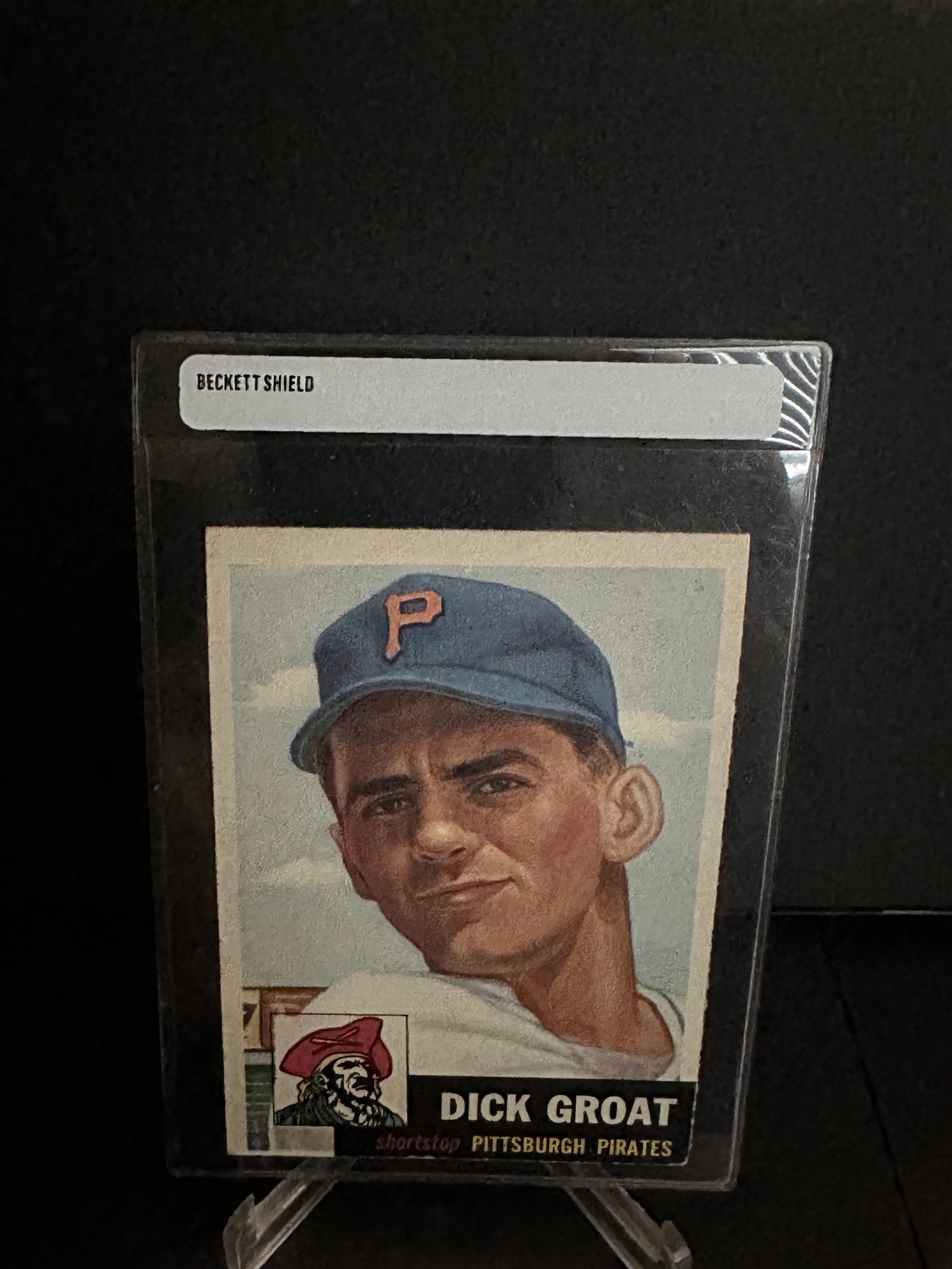 1952 Topps Dick Groat Baseball Card: This is a 1952 Topps Dick Groat baseball card featuring the shortstop for the Pittsburgh Pirates. The card has been sealed and graded, making it a notable collectible item. It highlights Groat's portr