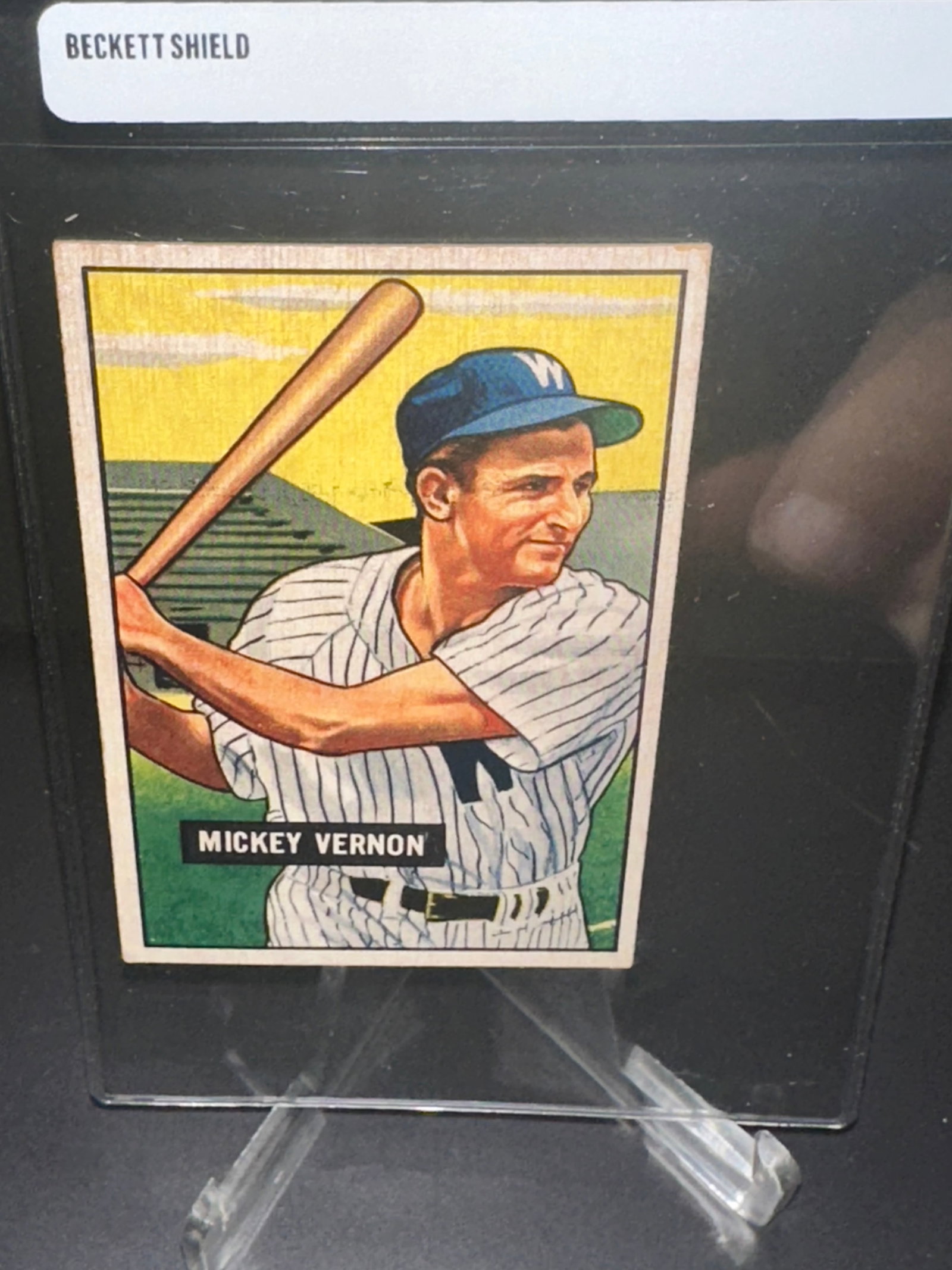 1951 Bowman James Vernon Baseball Card: This is a 1951 Bowman James Vernon baseball card featuring the Hall of Famer in a batting pose. The card is part of the 1948 Leaf set, widely recognized for its vibrant artwork and unique design. This