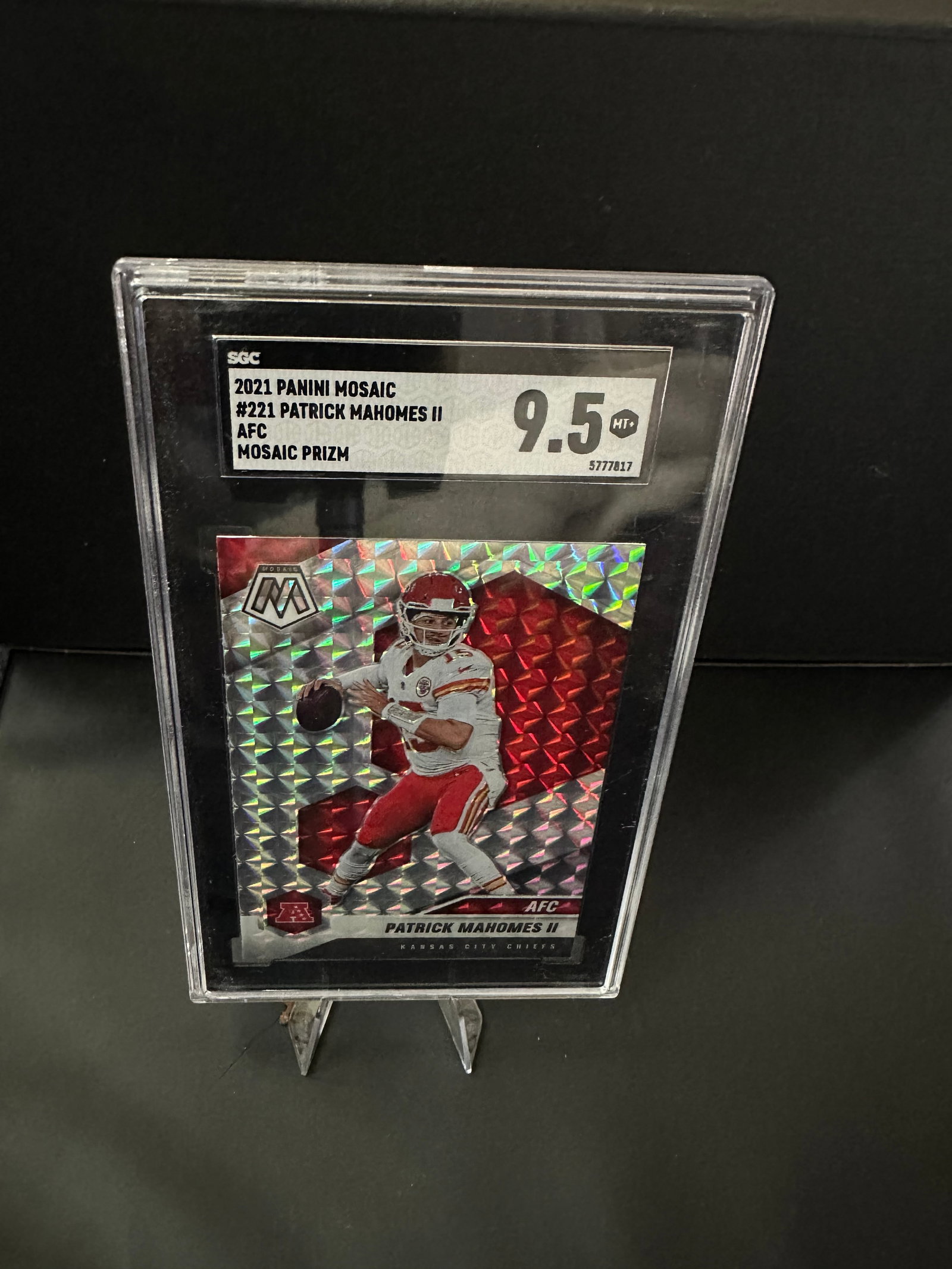 2021 Panini Mosaic Patrick Mahomes II Card: This is a 2021 Panini Mosaic trading card featuring Patrick Mahomes II, quarterback for the Kansas City Chiefs. The card is numbered #221 and comes with a high grade of 9.5, indicating excellent condi