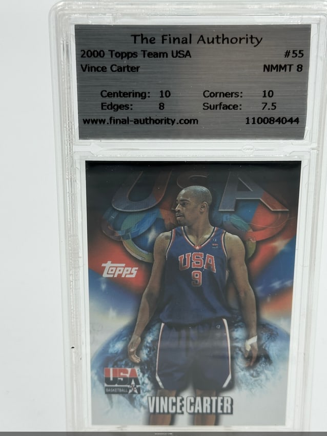 2000 Topps Team USA Vince Carter Basketball Card: 2000 Topps Team USA basketball card featuring Vince Carter, card number #55. It is graded NM/Mint 8, with centering and corners both rated at 10. The card showcases Carter in his Team USA uniform, mak
