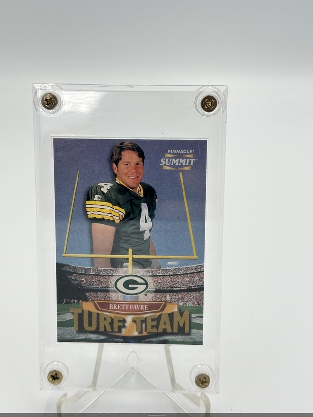 Brett Favre Pinnacle Summit Turf Team Card 1996: Brett Favre 'Turf Team' card from the Pinnacle Summit series, featuring the legendary quarterback in his Green Bay Packers uniform. The card showcases an image of Favre with a football field backgroun