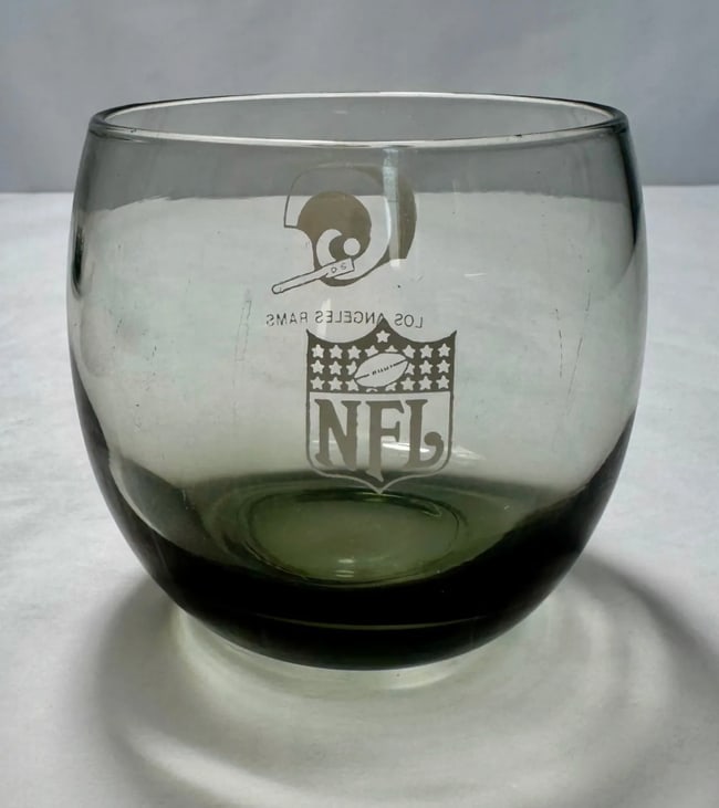 Four Vintage Los Angeles Rams drinking glasses: A set of four vintage drinking glasses featuring the Los Angeles Rams logo, perfect for collectors and fans. These stylish glasses add a sporty touch to any gathering. Shipping:If you did not want Liv