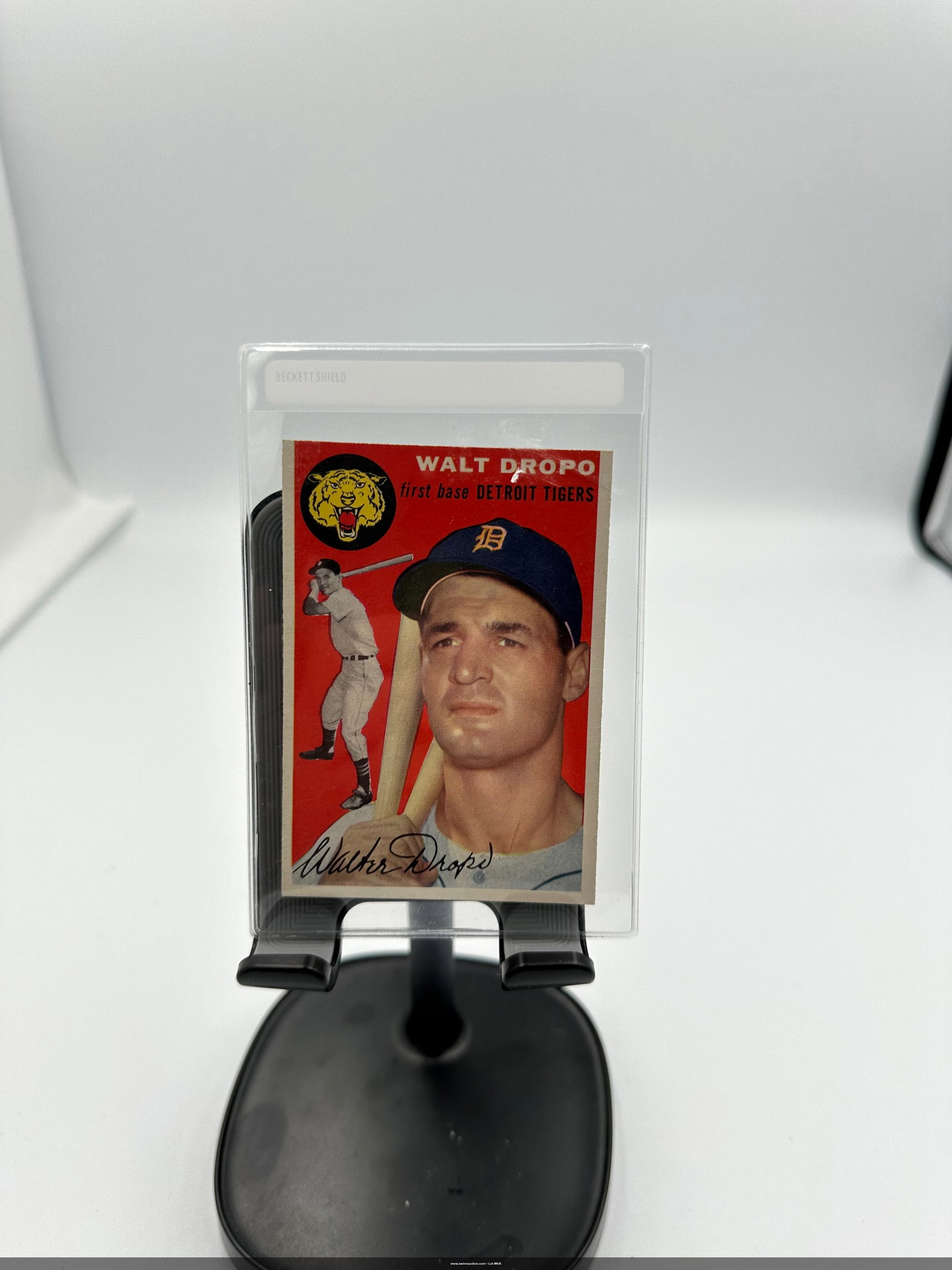 Walt Dropo 1954 Topps Baseball Card: a 1954 Topps Walt Dropo baseball card, featuring the first baseman for the Detroit Tigers. The card showcases a vibrant red background with a portrait of Dropo, along with a smaller image of him batti