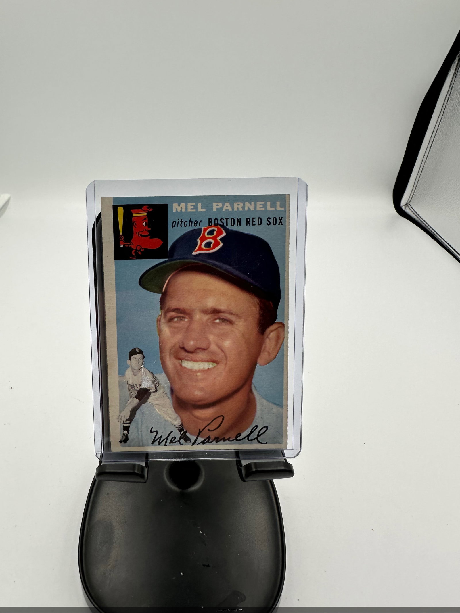Vintage 1954 Topps Mel Parnell #40 baseball card.: a 1954 Topps baseball card featuring Mel Parnell, a pitcher for the Boston Red Sox. The card includes Parnell's signature and showcases a classic design with vibrant colors typical of that era.The car