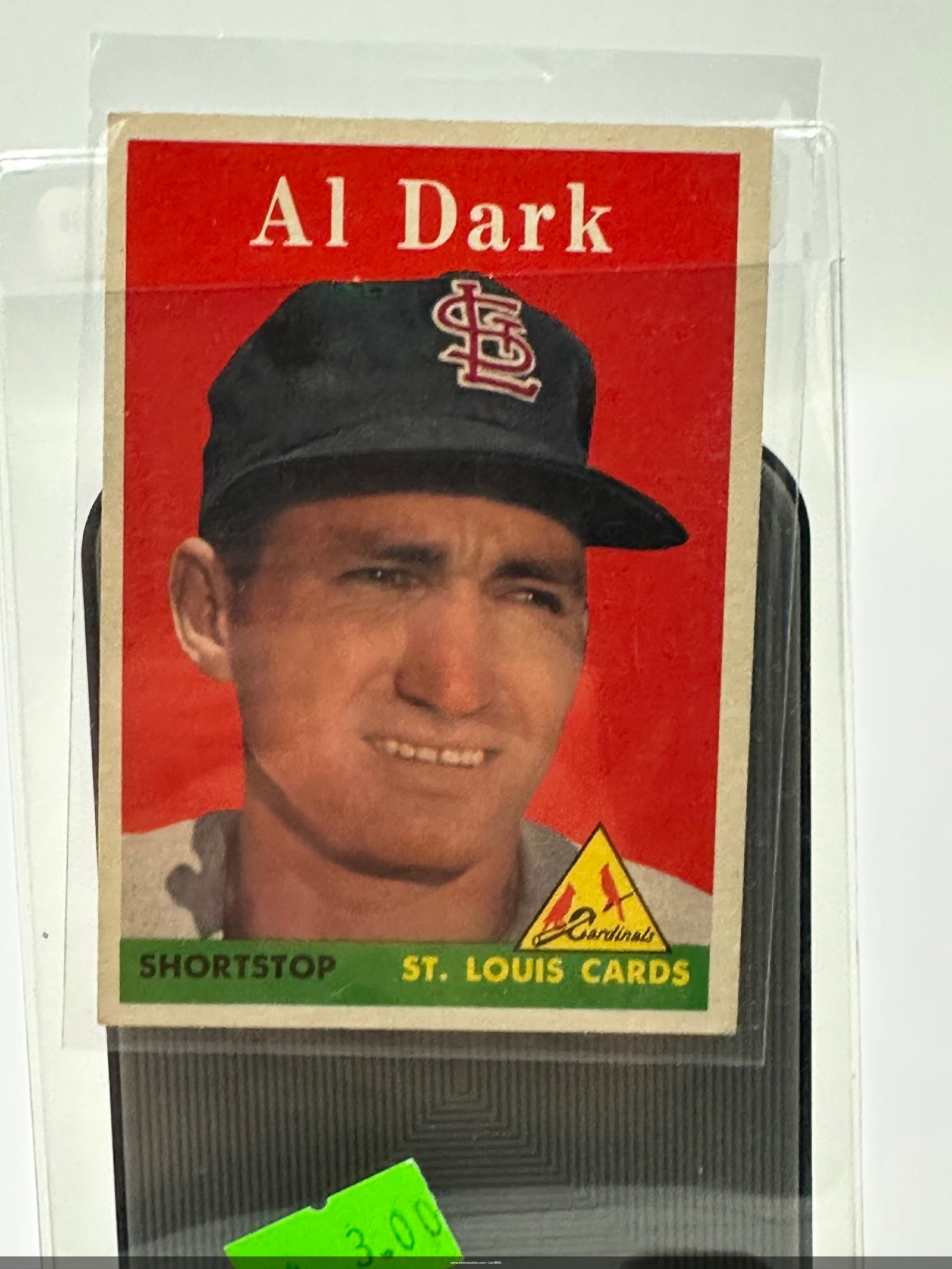 1958 Al Dark St. Louis Cardinals Baseball Card: 1958 baseball card featuring Al Dark, a shortstop for the St. Louis Cardinals. The card displays a vibrant red background with Dark's image and is marked with the Cardinals logo.It is from the 1958 se