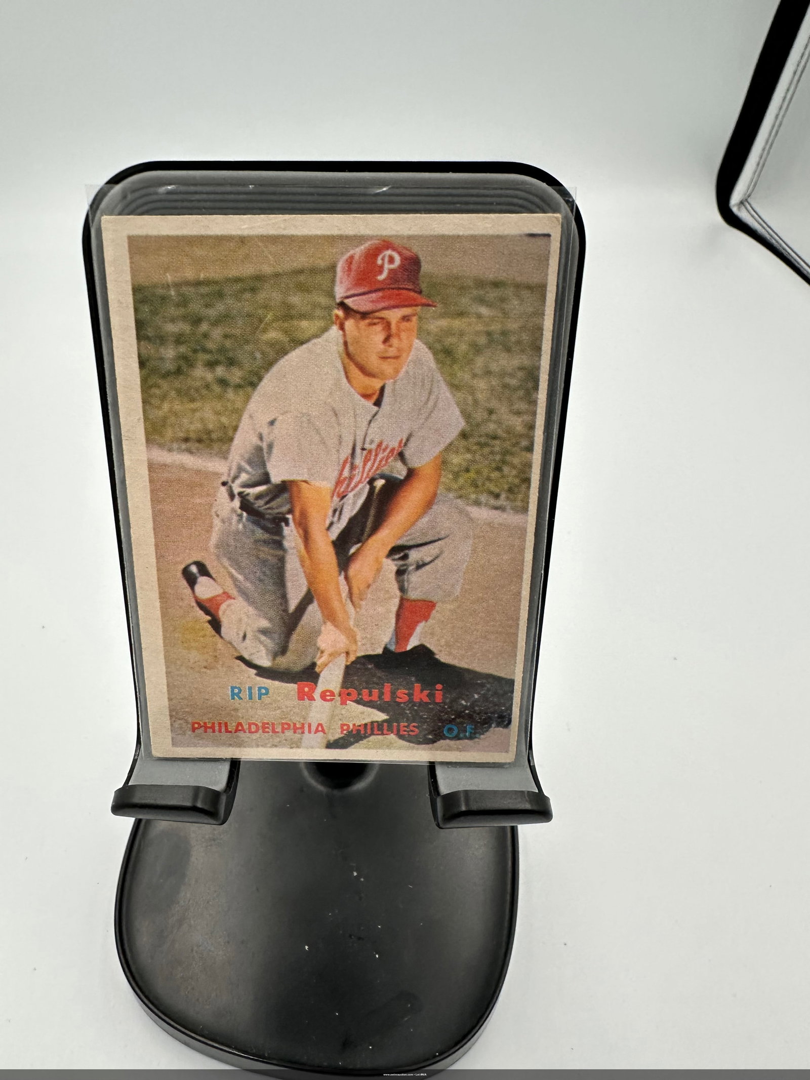 1957 Topps Rip Repulski Baseball Card: Rip Repulski, an outfielder for the Philadelphia Phillies. The card showcases Repulski in a classic baseball pose, wearing a Phillies uniform and cap. It is a vintage card reflecting the era's basebal