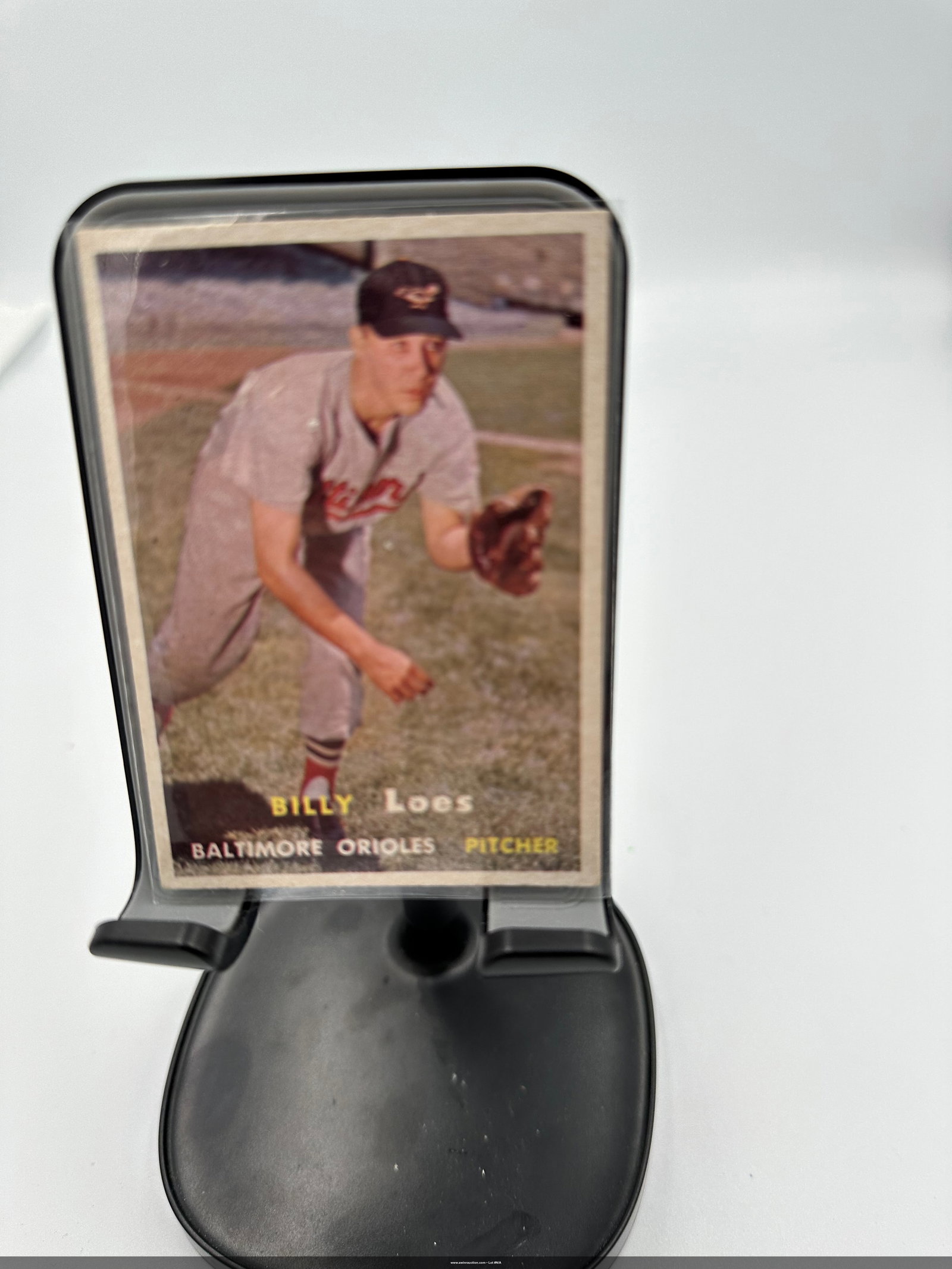 1957 Billy Loes Baltimore Orioles Baseball Card: Billy Loes, who pitched for 11 seasons in the Major Leagues. Billy Loes, a pitcher for the Baltimore Orioles. The card showcases Loes in his team uniform, capturing him in a poised throwing stance on 