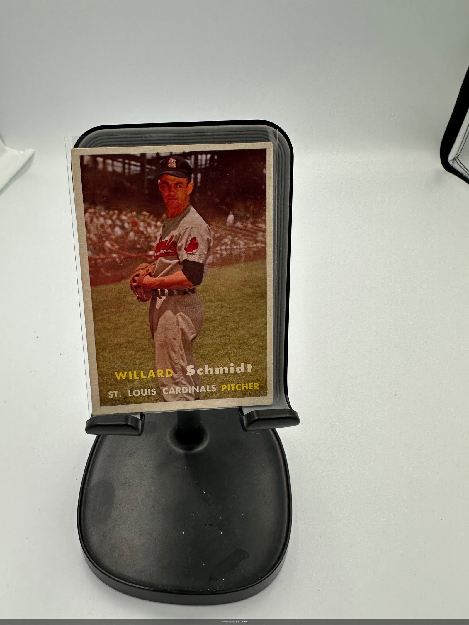 Willard Schmidt St. Louis Cardinals Baseball Card: a vintage baseball card featuring Willard Schmidt, a pitcher for the St. Louis Cardinals. The card showcases a colorful image of Schmidt in his uniform, with a depiction of a baseball field in the bac