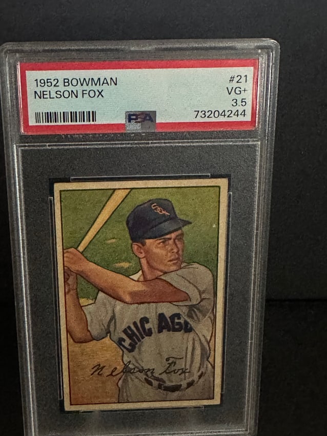 Graded - Vintage 1952 Nelson Fox baseball Bowman set, numbered #21.: Vintage 1952 Nelson Fox baseball card from the Bowman set, numbered #21. The card is graded VG+ (3.5) by PSA, indicating good condition with some signs of wear. Nelson Fox is depicted in his Chicago