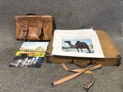Vintage Leather Cases and Photographs: Vintage leather carrying case and portfolio and assorted color photographs depicting various landscapes, wildlife, and cityscapes. Images include scenic and wildlife themes. Collectible Item