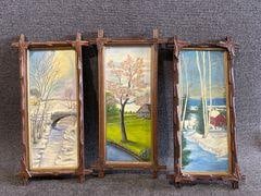 Vintage Framed Landscape Paintings: Three vertical framed paintings featuring seasonal landscapes. Includes snowy river scenes and a spring countryside view. Frames have carved leaf accents. Paintings are in great conditions. Frames