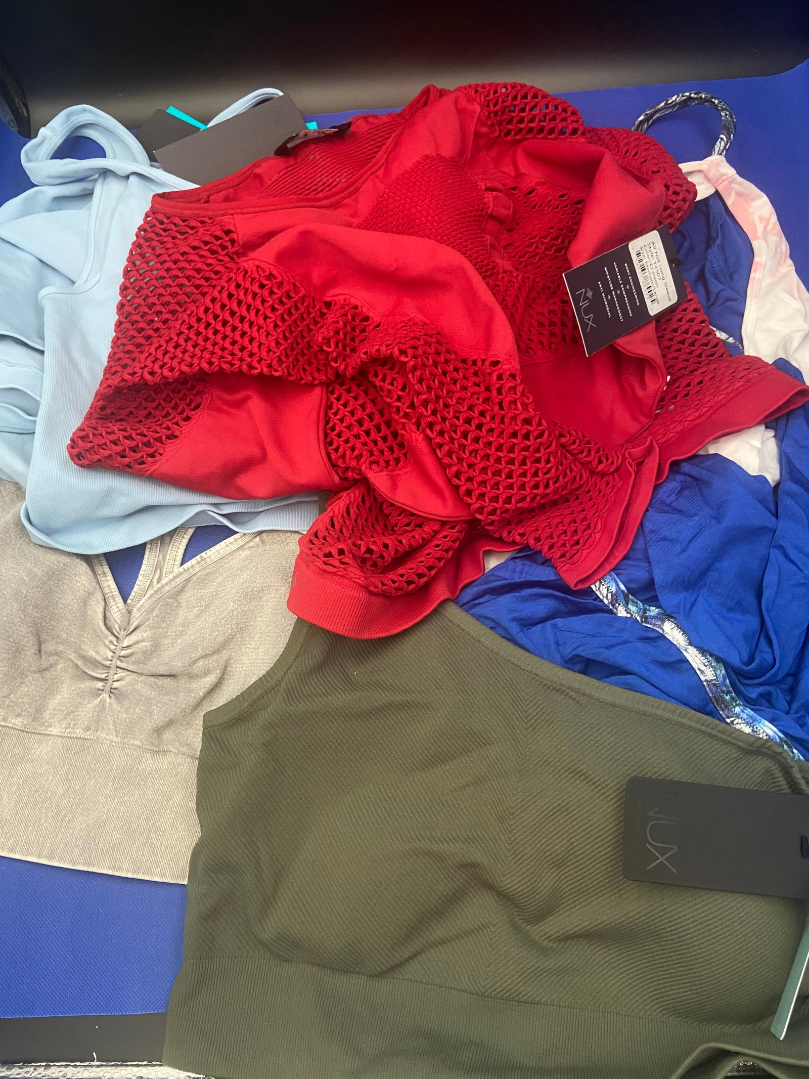 Activewear brand new: A variety of brand new with tags NUX activewear tops size Large. Variety of colors and styles. Lot of 11 High Estimate: 500.00