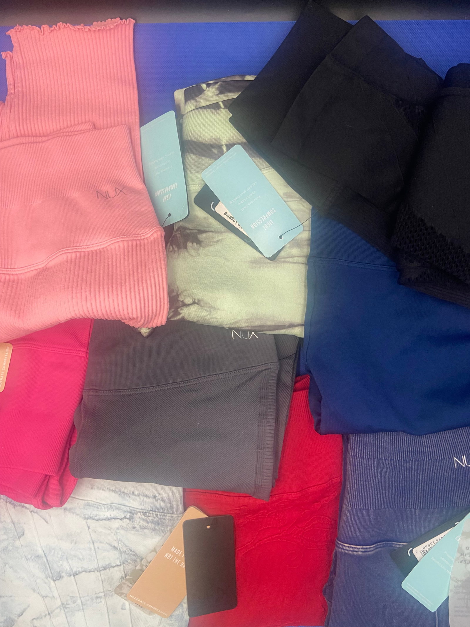 Brand New with tags Activewear: Brand New with Tags NUX activewear leggings. A variety of colors and styles. All sized medium. Lot of 9 High Estimate: 500.00