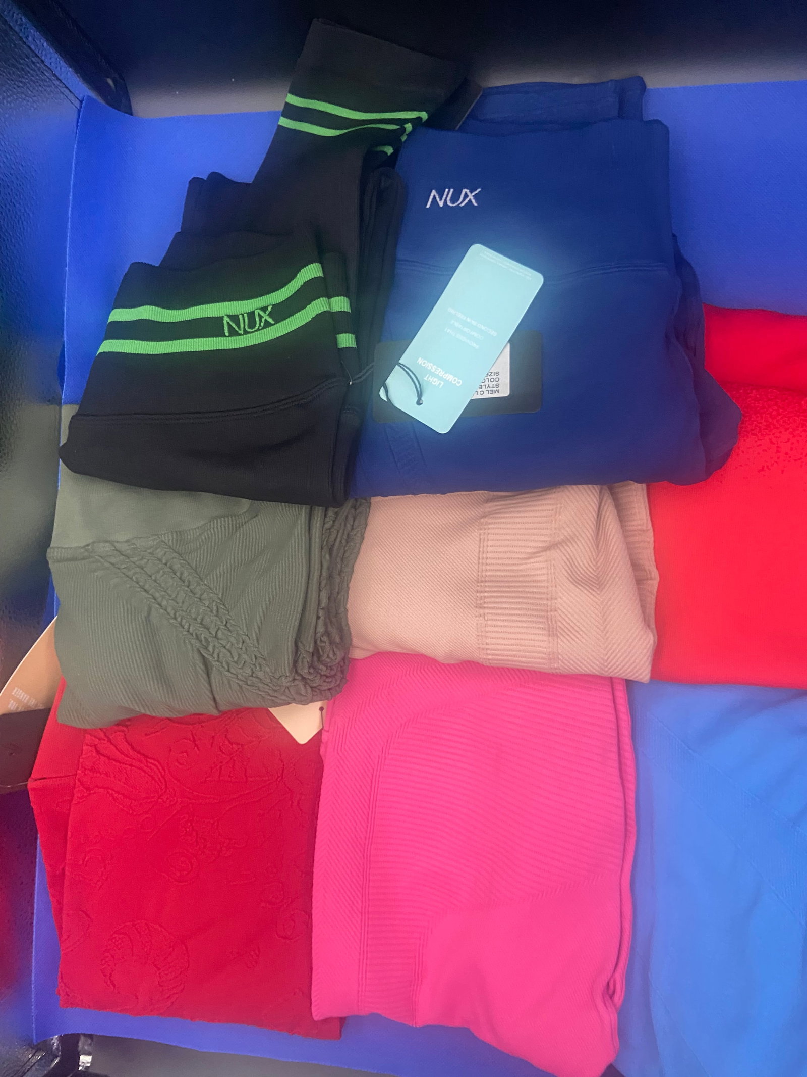 Activewear brand new: Brand New with Tags NUX activewear leggings. Variety of colors and styles. All in size medium. Lot of 9 High Estimate: 500.00